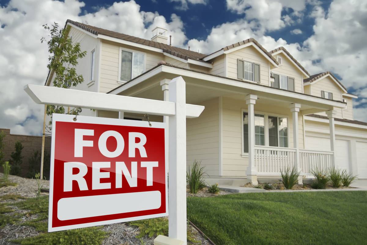 House with a for rent sign