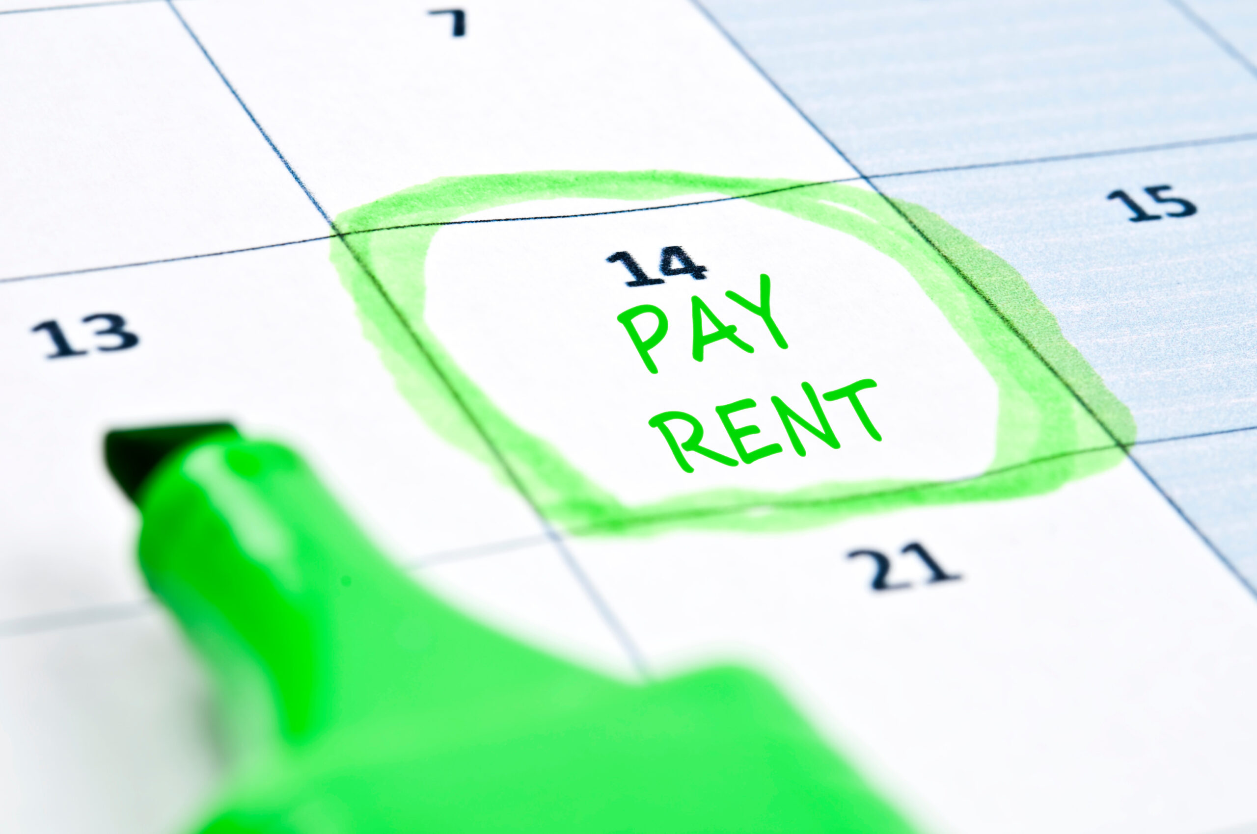 calendar with "pay rent" marked and circled