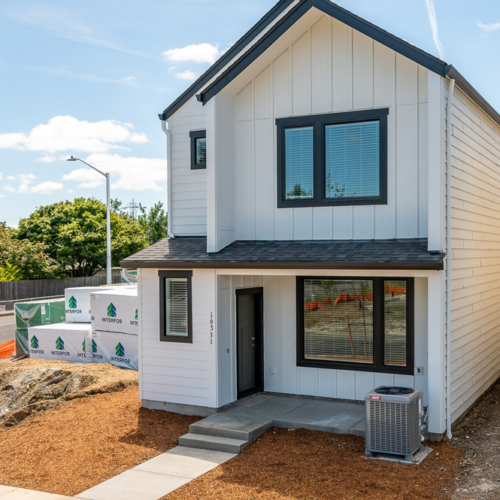 Front exterior of townhome at Grove at 162nd