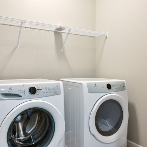 Full size washer and dryer with wire shelf