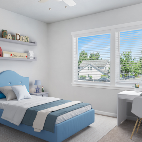 Bedroom with twin bed and desk and brown carpet and large window