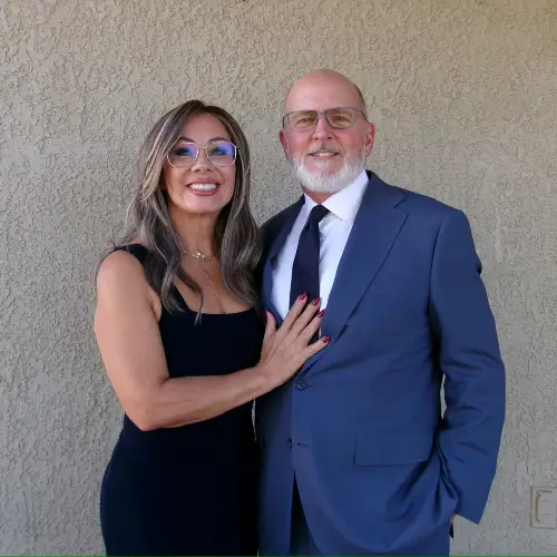 Denny and Johanna Miller standing together, owners of Zenith Properties NW