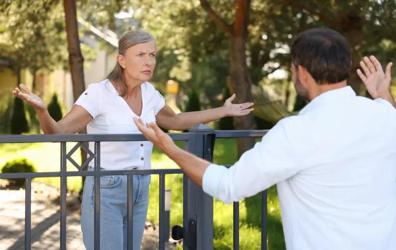 Two rental tenants in a heated argument. Find out how to handle problem tenants in this guide from Zenith Pro.
